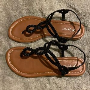 Brown and black sandals , no damage .